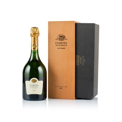 the bottle of champagne is next to a cardboard box