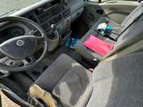 a view of the inside of a vehicle from the driver ' s seat