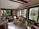 a living room with a lot of windows in it