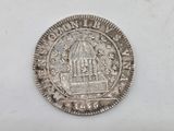 a close up of a silver coin with a bird on it