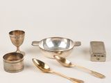 a lot of silver items that are on the table