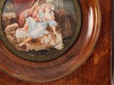a picture of a picture of a woman and child on a clock