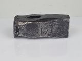 an image of a silver piece of metal on a white surface