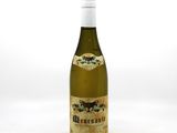 a bottle of wine that is sitting on a table