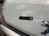 a close up of a car badge on the hood of a car