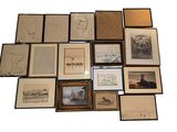 a lot of framed pictures on the wall of this room