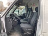 the interior of a van with the door open and the driver ' s seat up