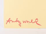 a yellow post it note with a red writing on it