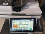 a tablet that is sitting on top of a printer