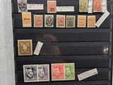 a picture of a collection of stamps on display in a glass case