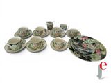 a lot of cups and saucers that are sitting on a table