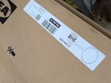 a box with a sticker on it sitting on the floor