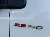 a close up of the emblem on a white car