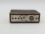 an old fashioned radio sitting on top of a white surface