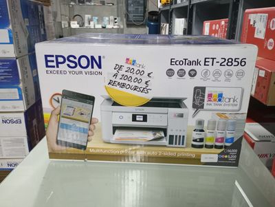 a box with a printer and a cell phone in it