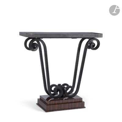 a black iron console table with a marble top on a wooden base