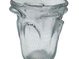 a clear glass vase with a handle on a white background