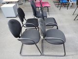 many chairs that are lined up in a room