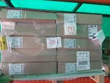 a large stack of boxes sitting on a pallet in a warehouse