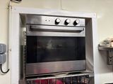 a stainless steel oven that is in a kitchen