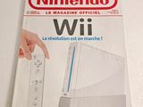 nintendo wii magazine cover with a hand pointing at a wii controller