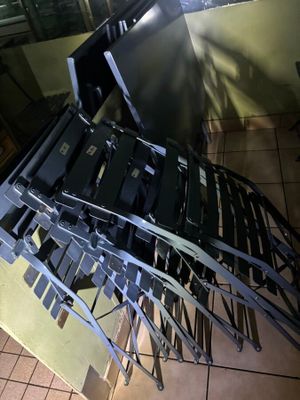 a pile of laptops sitting on top of a table