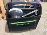 a black bag with tools in it sitting on the ground