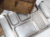 a lunch box and a backpack sitting on a table