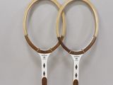 two tennis racquets that are on a table