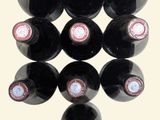 bottles of wine are arranged in a triangle on a white background