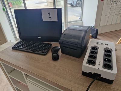 a desk with a computer, keyboard, mouse, and printer on it
