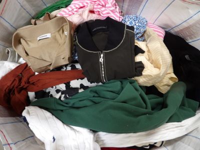 a basket full of clothes that is sitting on a table