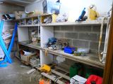 a room that has a bunch of shelves and tools on it