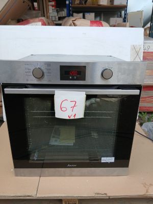 an oven that is sitting on top of a cardboard box
