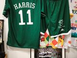 two jerseys hanging on a wall in a room