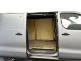 a silver van with its doors open and a door open