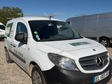 a white van that is parked in a lot
