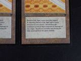 two cards that are sitting on a table