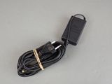 a cord that is connected to a charger on a table