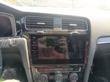 the interior of a car with a person taking a picture of the dashboard