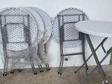 two chairs and a table in the corner of a room