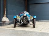an image of a car parked in front of a garage