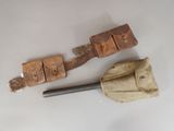 two old tools that are sitting on a table