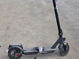 a scooter that is sitting on the pavement