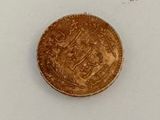 an image of a gold coin on a white surface