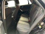 the back seats of a car are empty and the passenger seat is empty