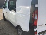 a white van that is parked in a parking lot