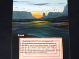 a card with a picture of a sunset on it