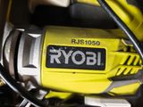 a close up of a yellow and black power tool