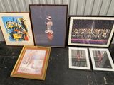 three framed pictures on the floor next to a picture